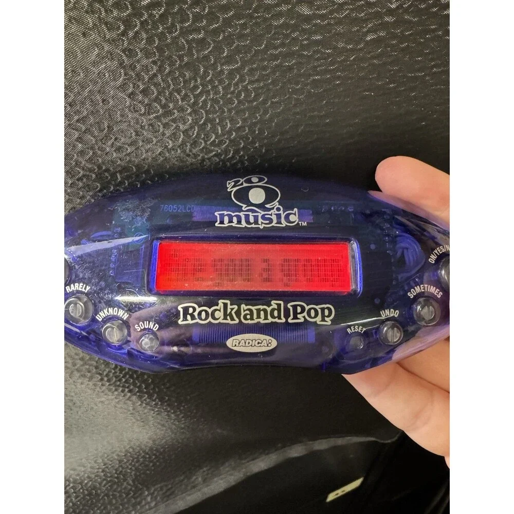 Set of 2 Radica 20Q Handheld Electronic Games Regular and Rock and Pop Music
